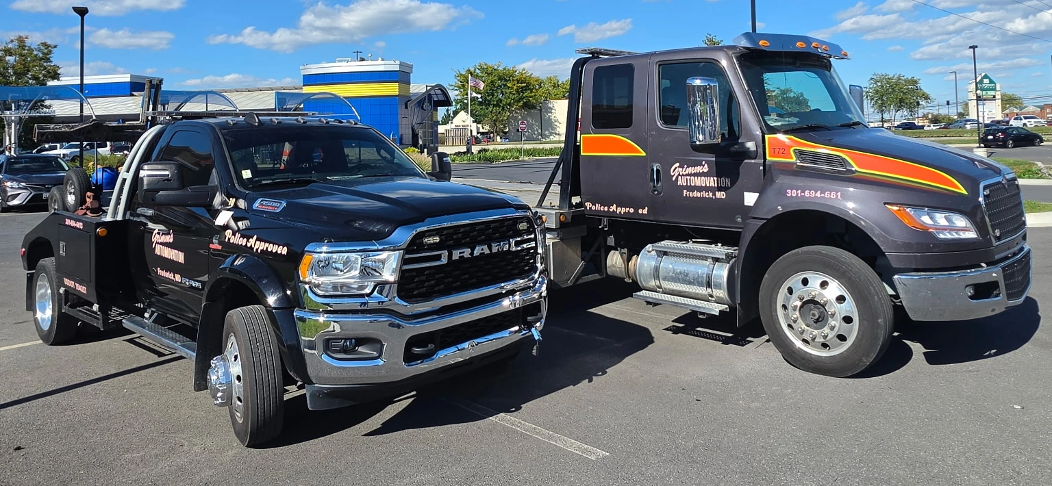 Grimm's two tow trucks with their original paint, equipment and door markings